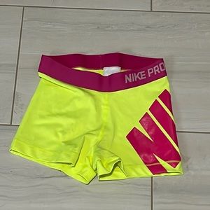 Neon yellow and pink Nike Pros